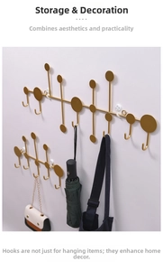 Detail of creative gold geometric wall hooks showing mounting layout and modern home decor