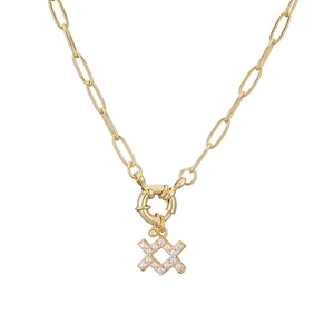 Detail of gold paperclip chain necklace with pearl-inlaid cross pendant and steering buckle