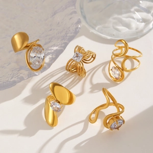 Detailed view of 5-piece gold stainless steel rings set with zircon in a creative display