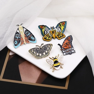 Set of 5 retro insect enamel pins including butterfly and bee styles in colorful designs