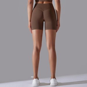 Close-up of deep brown high-waisted seamless gym shorts with V-shape booty lifting stitching