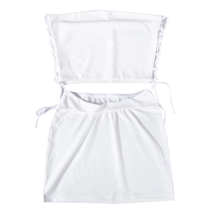 Detail of white ribbed knit two-piece set featuring tube top and drawstring skirt