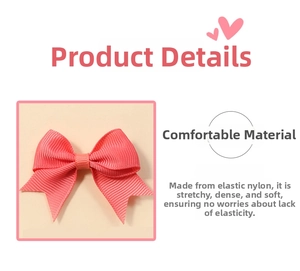 Detail of pink grosgrain ribbon bow with a soft nylon elastic headband for infants