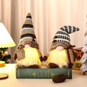 Lighted coffee-themed gnome pair ornaments on vintage books for cozy home decor