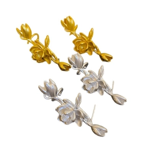 Vintage style lotus flower stud earrings in matte gold and silver finish with floral branch