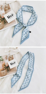 Detailed views of floral blue silk scarf showing tied knot and flat layout on white shirt