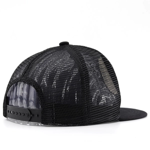 Rear view of black mesh trucker hat with adjustable snapback strap and breathable structure
