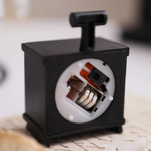 Macro view of the mini LED fireplace internal components with 3 button batteries and switch