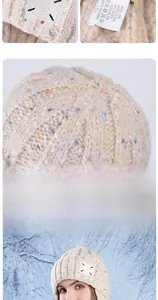 Detail of oatmeal knit beanie showing colorful flecks and material label with 10% wool