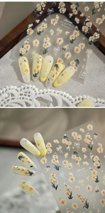 Detail of TL-421 embossed nail stickers with yellow flowers and 3D white bow designs