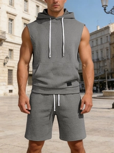 Detail of grey sleeveless hoodie and shorts set with geometric twill texture and drawstrings