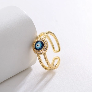 Detail of 18K gold-plated Evil Eye ring with blue enamel and sparkling cubic zirconia