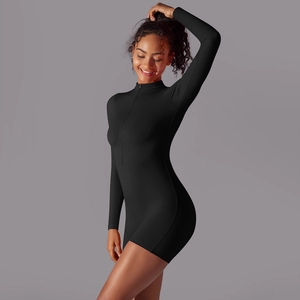 Close-up of black long sleeve bodysuit showing slim fit fabric and front zipper detail