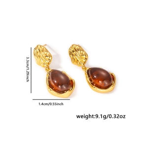 Detail showing dimensions of vintage gold metal teardrop earrings with amber resin stones