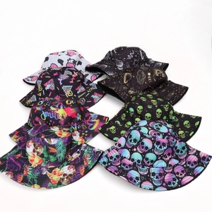 Detail showing various skull and neon prints on a reversible cotton fisherman bucket hat