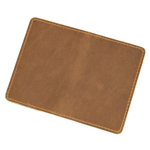 Detailed close-up showing brown crazy horse leather texture and stitching on the pouch