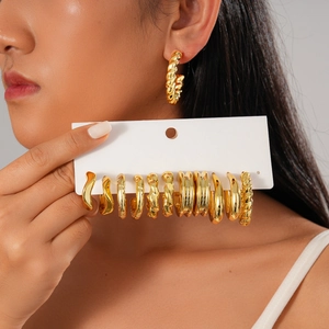 12-piece set of geometric round gold hoop earrings with twisted and pleated metal designs