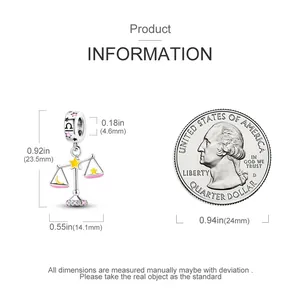 Detailed dimensions of the luminous Libra zodiac charm next to a 25-cent coin