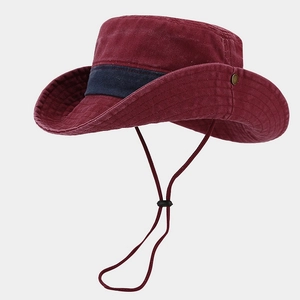 Detail of burgundy washed cotton bucket hat with blue strap and adjustable chin cord