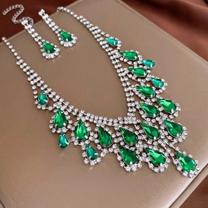 Detailed view of emerald water drop crystal necklace and matching earrings set