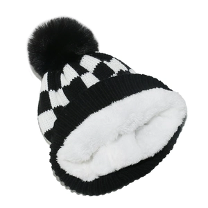 Winter checkerboard knit beanie with warm fleece lining and black faux fur pompom detail