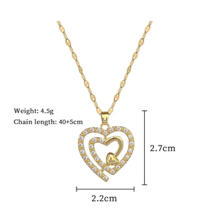 Detail view of gold double heart pendant necklace showing dimensions 2.7x2.2cm and 4.5g weight