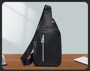 Close-up of woven leather chest bag texture with premium silver zipper and earphone port