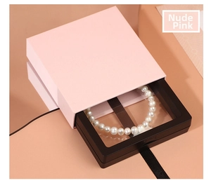 Detail of nude pink jewelry gift box with a black 3D floating display frame for necklaces