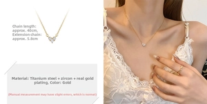 Detail of adjustable gold titanium steel heart necklace with cubic zirconia stones