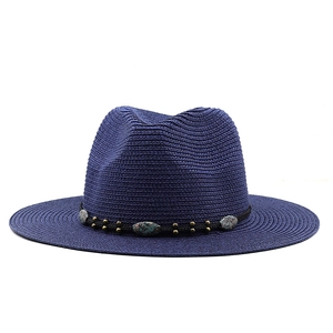 Detail of dark blue straw fedora with bohemian turquoise beads and bronze studs