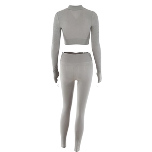 Rear view of grey ribbed knit two-piece set featuring cropped long sleeve top and leggings