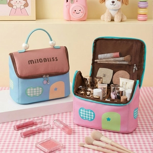 Cute pink and blue house-shaped makeup bag with pearl handle for travel and storage