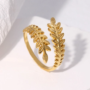 Adjustable golden leaf-shaped stainless steel open ring with a sleek wrap-around design