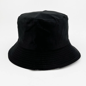 Detail of a black cotton bucket hat showing reinforced stitching on the brim and crown