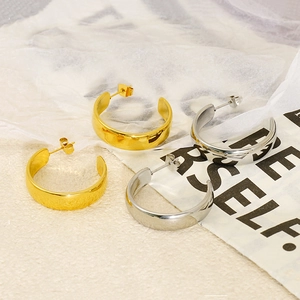 Polished two-tone C-shaped stainless steel earrings in gold and silver finish