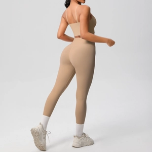 Detail of nude yoga set featuring thin straps sports bra and high waist leggings