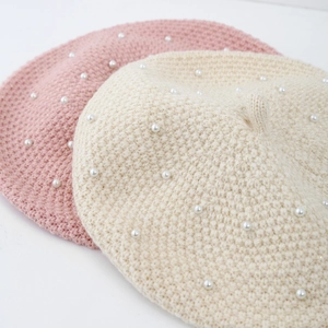 Elegant girls knitted beret with white pearls in soft pink and cream white colors
