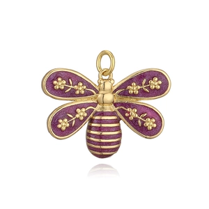 Macro view of purple glitter enamel bee pendant with golden metal outline and detailed wings