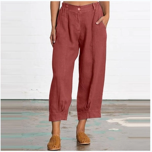 Detail of terracotta cotton linen loose pants with elastic high waist and deep side pockets