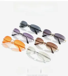 Detailed macro view of rimless cat-eye sunglasses with colorful gradient lenses and metal legs