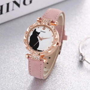 Close-up of pink leather strap watch with rose gold case and black cat silhouette dial