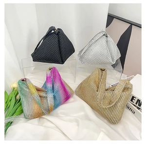 Detailed arrangement of luxury rhinestone evening bags in black, gold, and silver