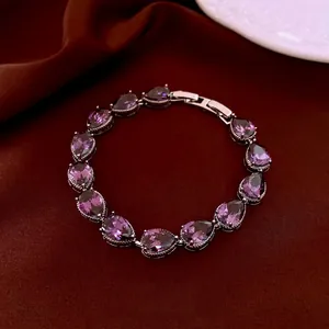 Luxury silver bracelet with drop-shaped purple zircon stones and metal fold-over clasp