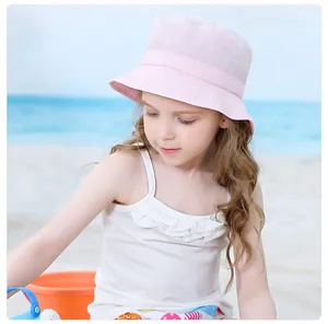Detailed view of child's pink sun hat with soft quick-dry fabric on a little girl