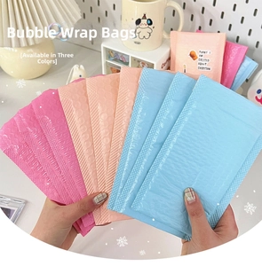Three-color cushioned bubble mailers in pink, blue, and orange with self-adhesive seal