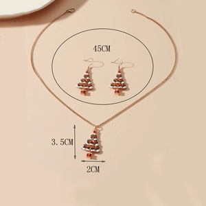Macro shot of colorful enamel Christmas tree jewelry set with exact size measurements