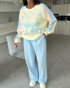 Detail view of American vintage color-block sweatshirt and pants set in pastel tones