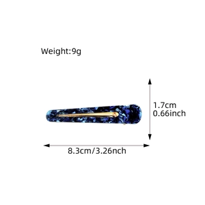 Dark blue marble acetate hair clip with golden metal clip and size measurements