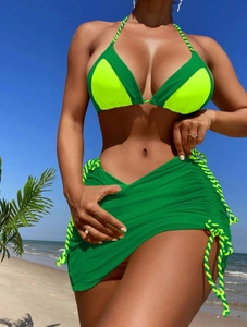 Detailed view of color block bikini with adjustable drawstring mesh sarong beach skirt