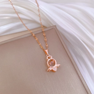 Elegant rose gold necklace with sparkling heart pendant on soft white silk background